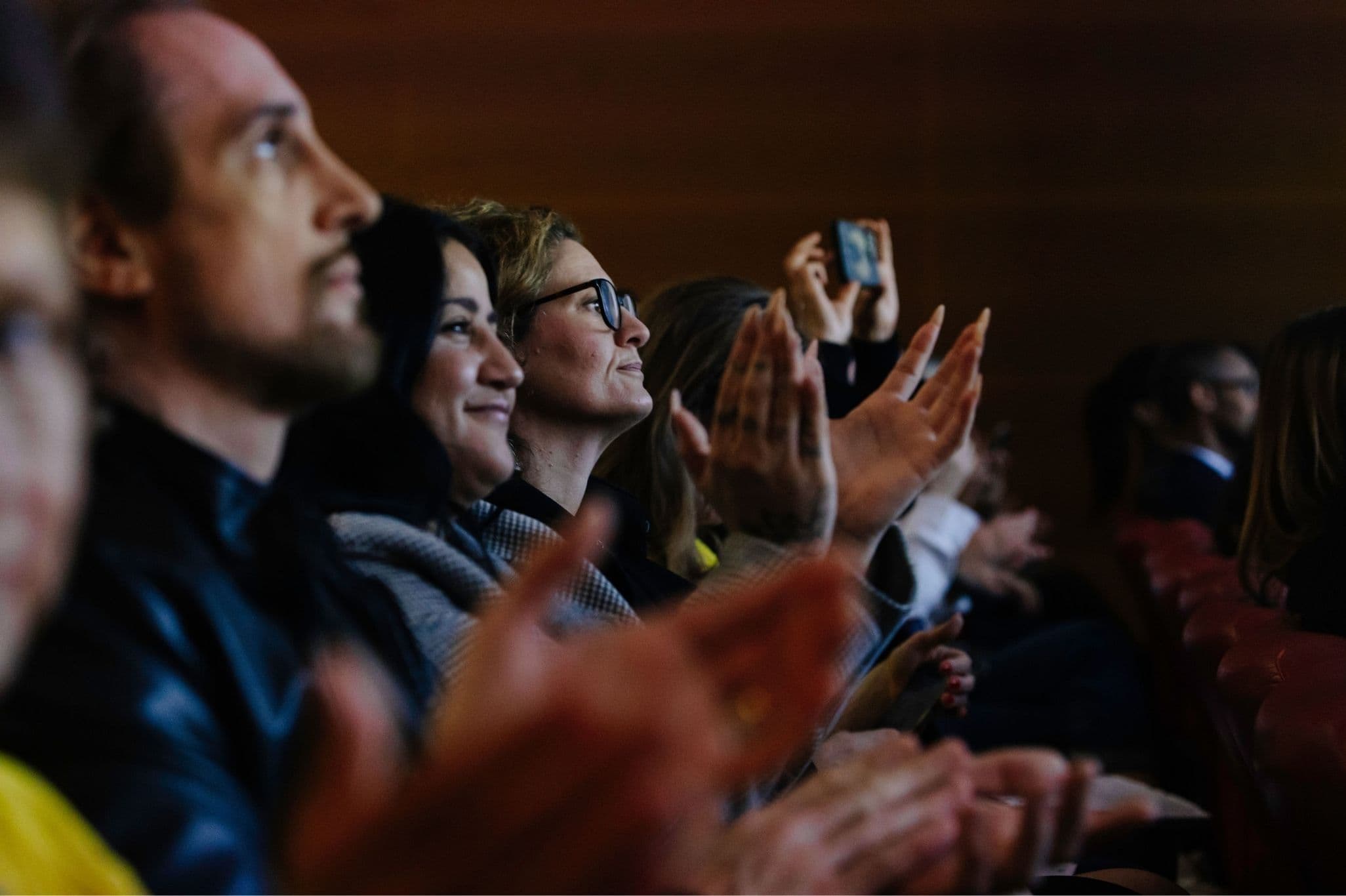 Delegates applauding at a conference